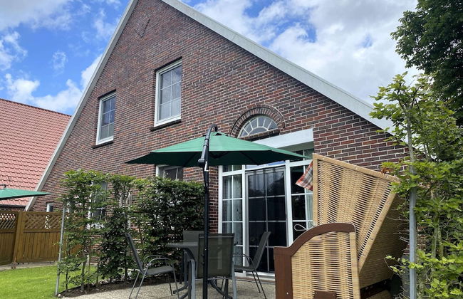 Reihenhauser in Strackholt - Foto 1