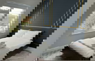 Foto 3 - London Studios and Suites
