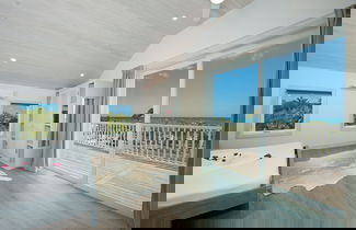 Photo 3 - Tropical Haven: Luxurious Home Steps From Beach