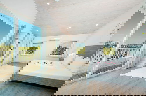 Photo 2 - Tropical Haven: Luxurious Home Steps From Beach