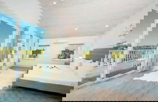 Photo 2 - Tropical Haven: Luxurious Home Steps From Beach