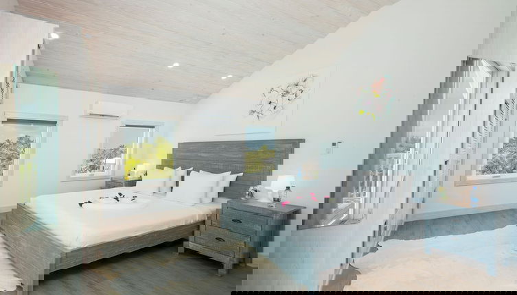 Photo 1 - Tropical Haven: Luxurious Home Steps From Beach
