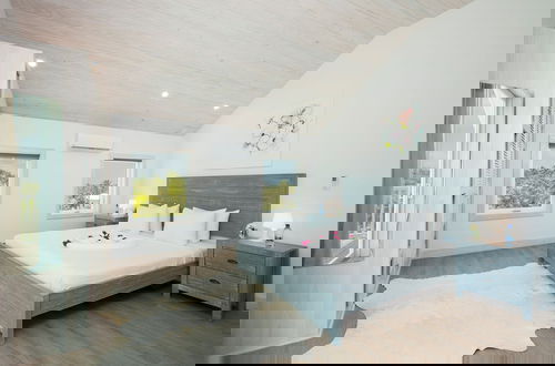 Photo 1 - Tropical Haven: Luxurious Home Steps From Beach