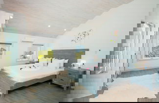 Photo 1 - Tropical Haven: Luxurious Home Steps From Beach