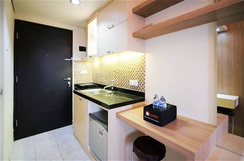 Photo 9 - Compact And Comfy Studio At Puri Mas Apartment