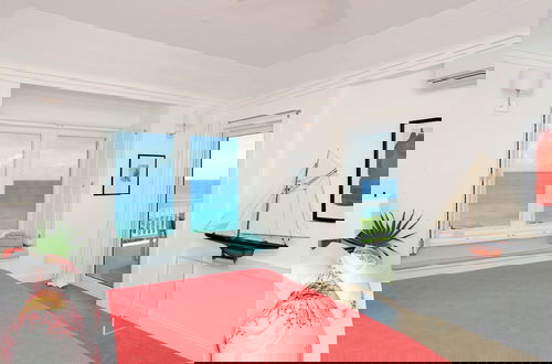 Photo 1 - Coastal Haven: Charming Beachfront Cottage With Pool