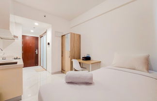 Photo 1 - Cozy Stay And Homey Studio Room Sky House Bsd Apartment