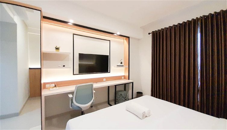 Photo 1 - Cozy Designed Studio At Patraland Amarta Apartment