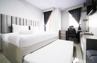 Foto 3 - Nice And Comfy Studio At Grand Dharmahusada Lagoon Apartment