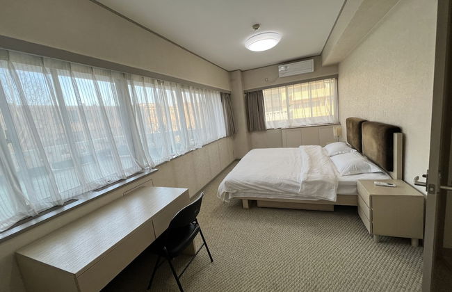 Beijing Jiuxian Apartment - Foto 4